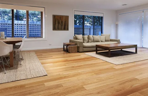 Modern living room with stylish furniture and large windows showcasing the Best Flooring for California Homes value in a contemporary home design.